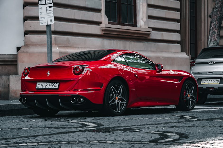 A stunning red sports car parked on an urban street, exuding luxury and style