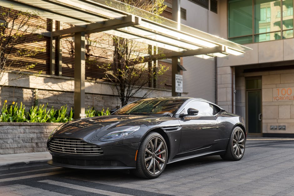 Sleek Aston Martin DB11 parked at Yorkville, Toronto, showcasing modern luxury.